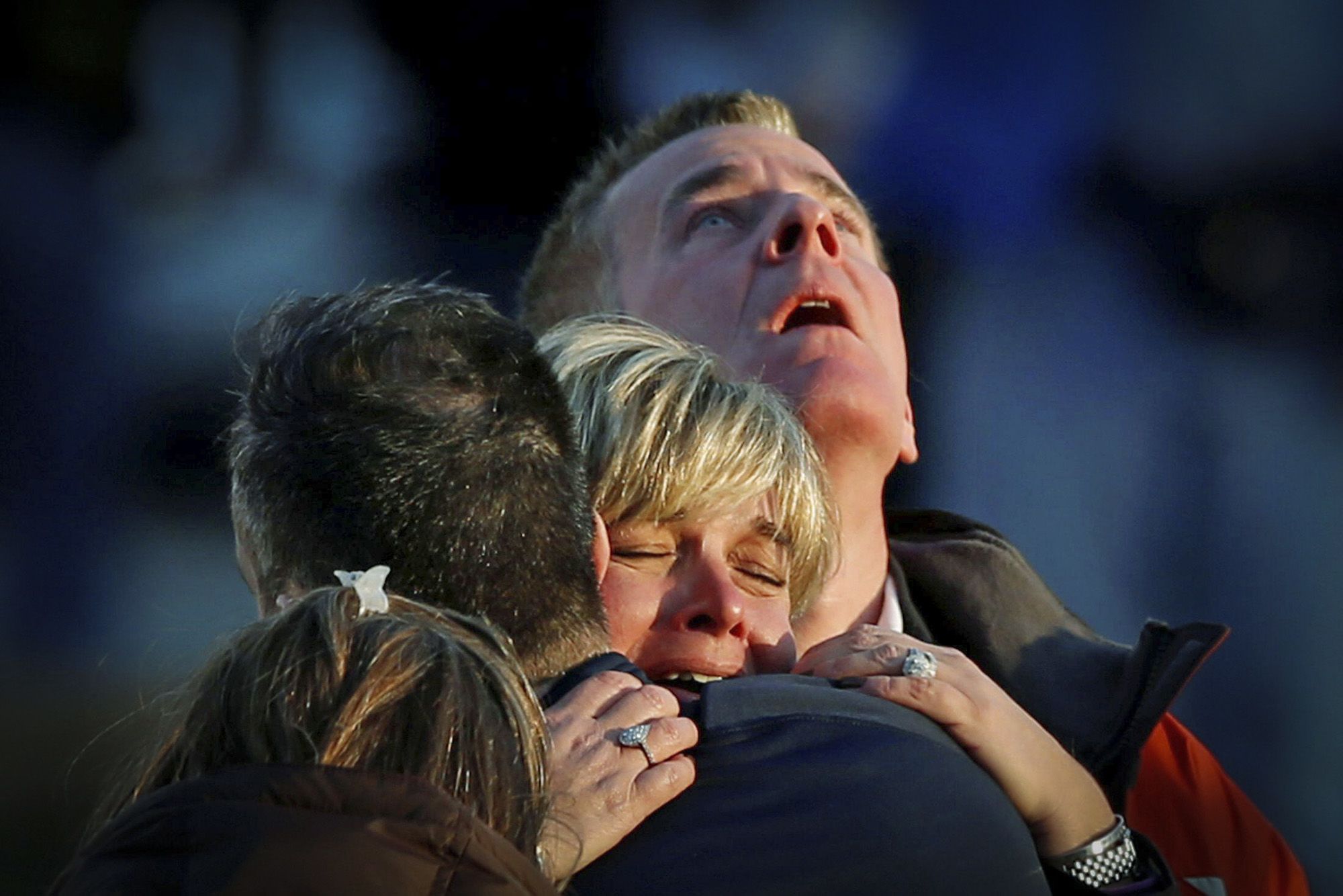 Lynn and Christopher McDonnell, the parents of seven-year-old Grace McDonnell, grieve near Sandy Hook Elementary after learning their daughter was one of 20 school children and six adults killed after a gunman opened fire inside the school in Newtown, Conn., on Dec. 14, 2012. (Adrees Latif / Reuters via Alamy)